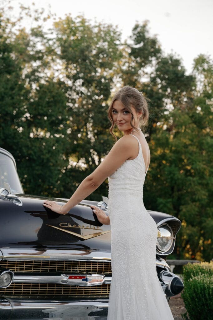 Bridal Portrait of bride with vintage getaway care in Nashville