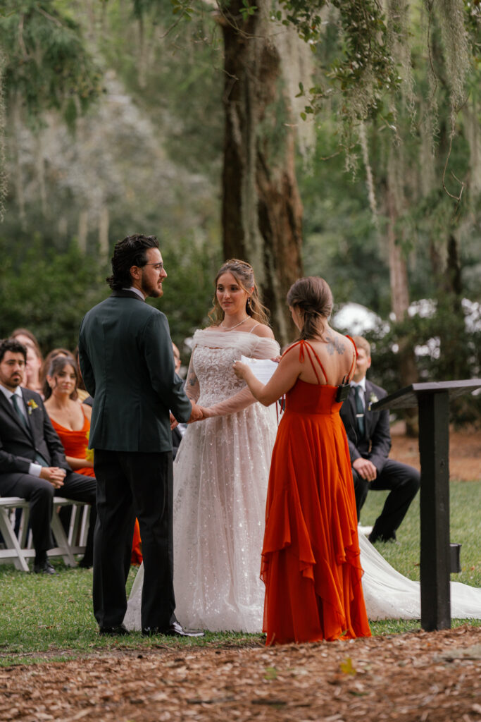 Bride and groom holding hands at the altar during a Nashville wedding ceremony.