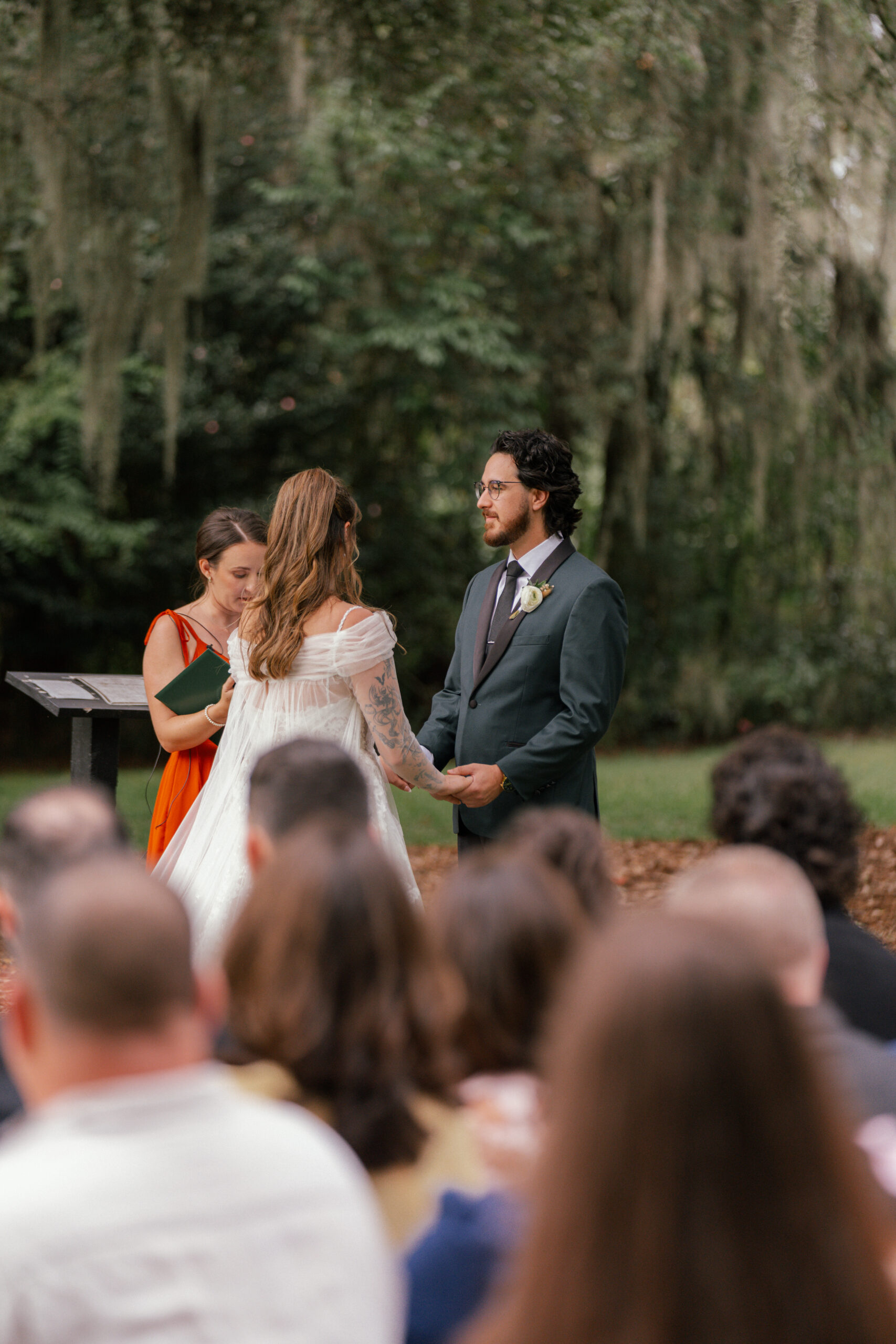 Bride and groom holding hands at the altar during a Nashville wedding ceremony.