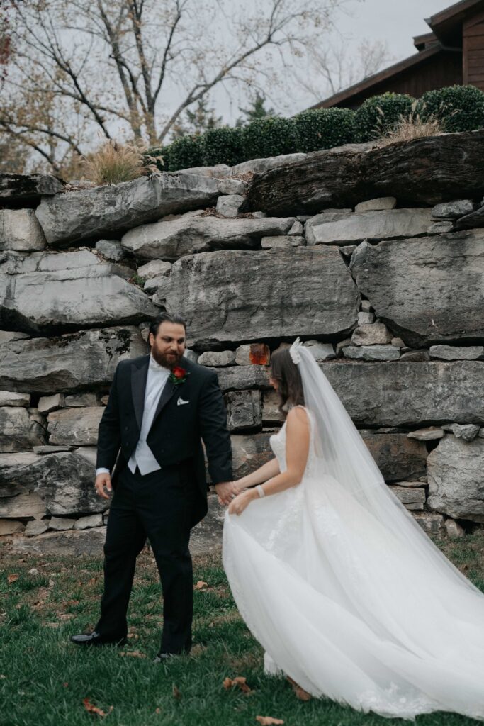 Groom leading his bride for portraits at their wedding in Nashville TN