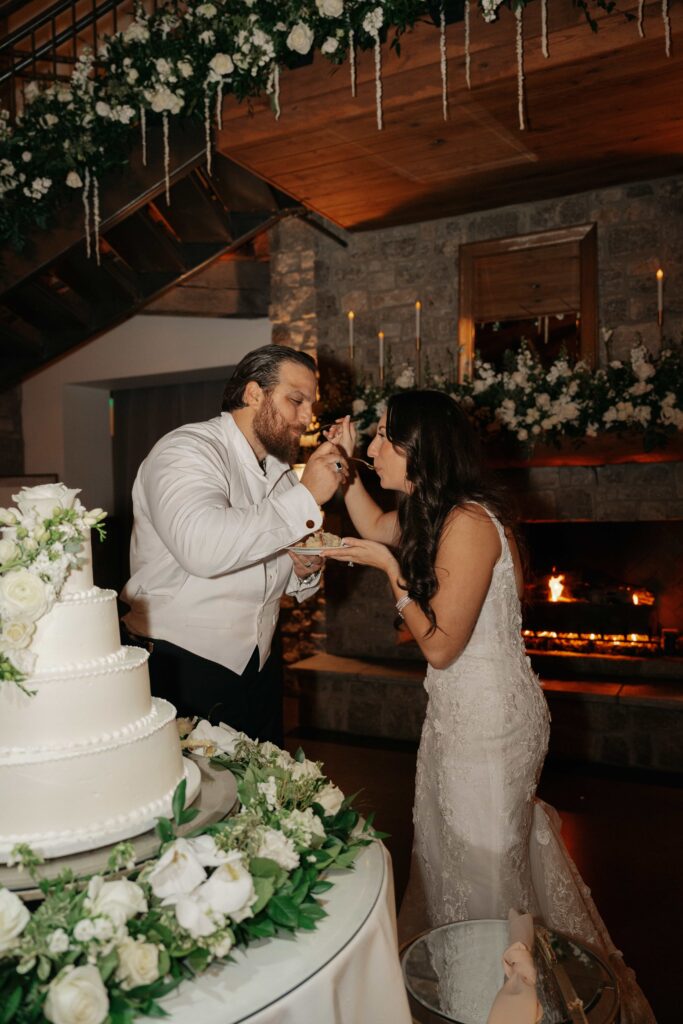 Bride and groom do their cake cutting for their wedding at Graystone quarry