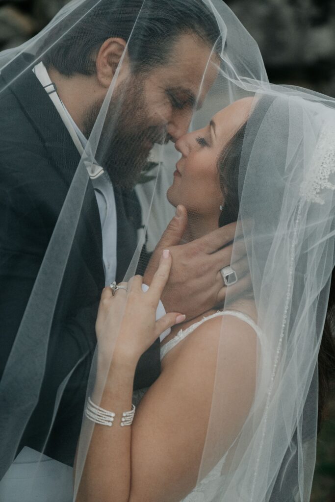 Bride and groom taking portraits at their Graystone Quarry wedding